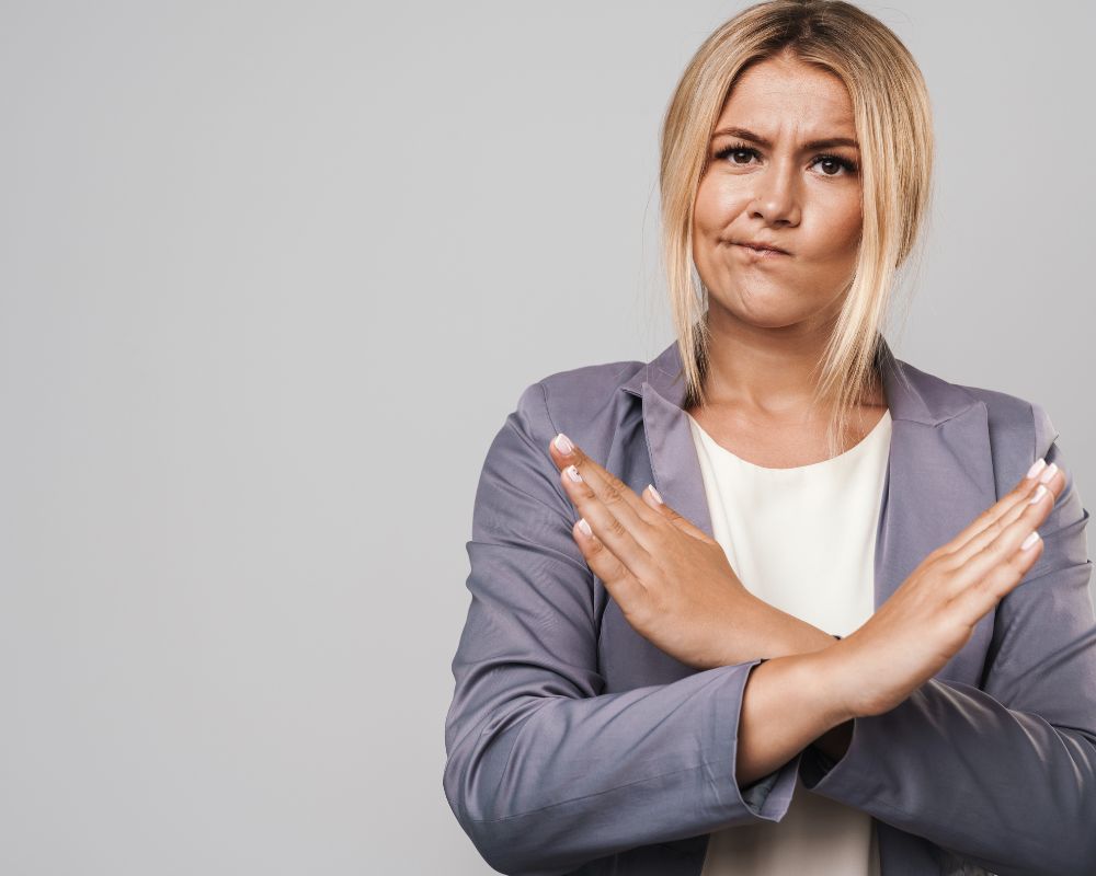 woman authoritatively making gesture of saying a "no"