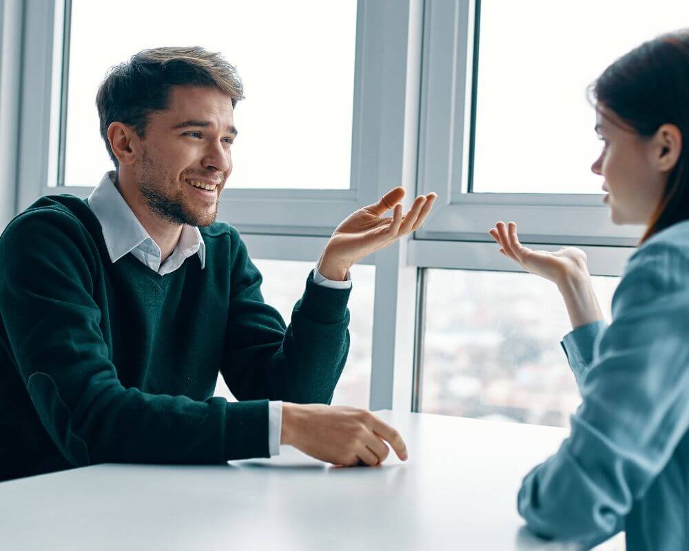 a guy talking to a woman