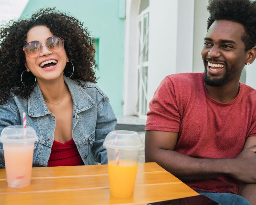 man and woman laughing together