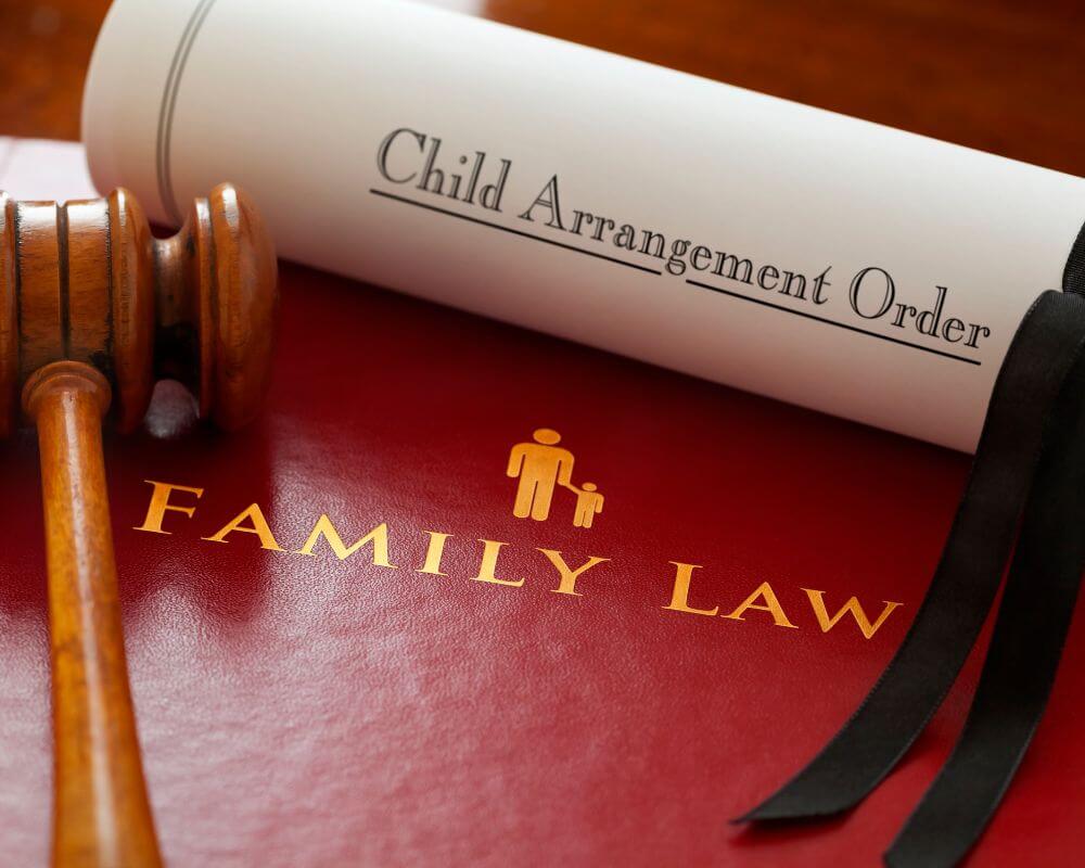 a document with "child engagement order" written on it lying on a table