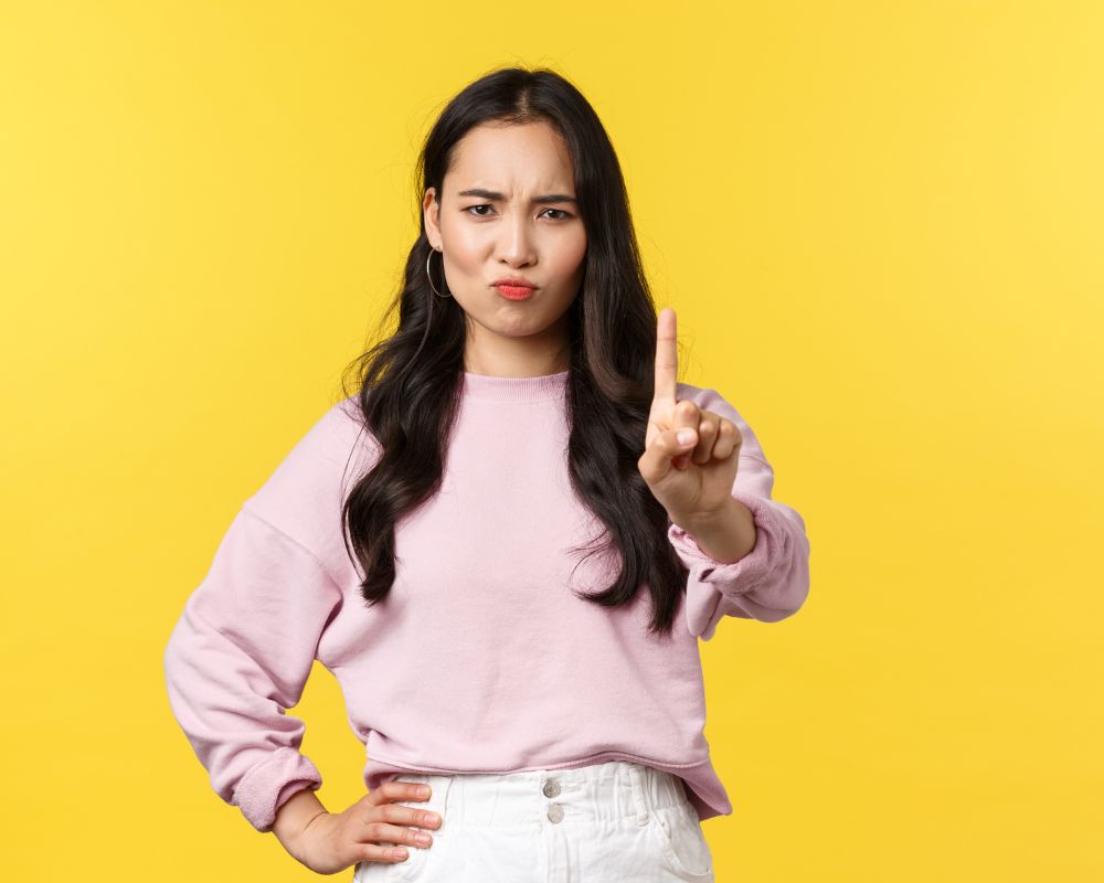 a woman gesturing to stop in a calm manner