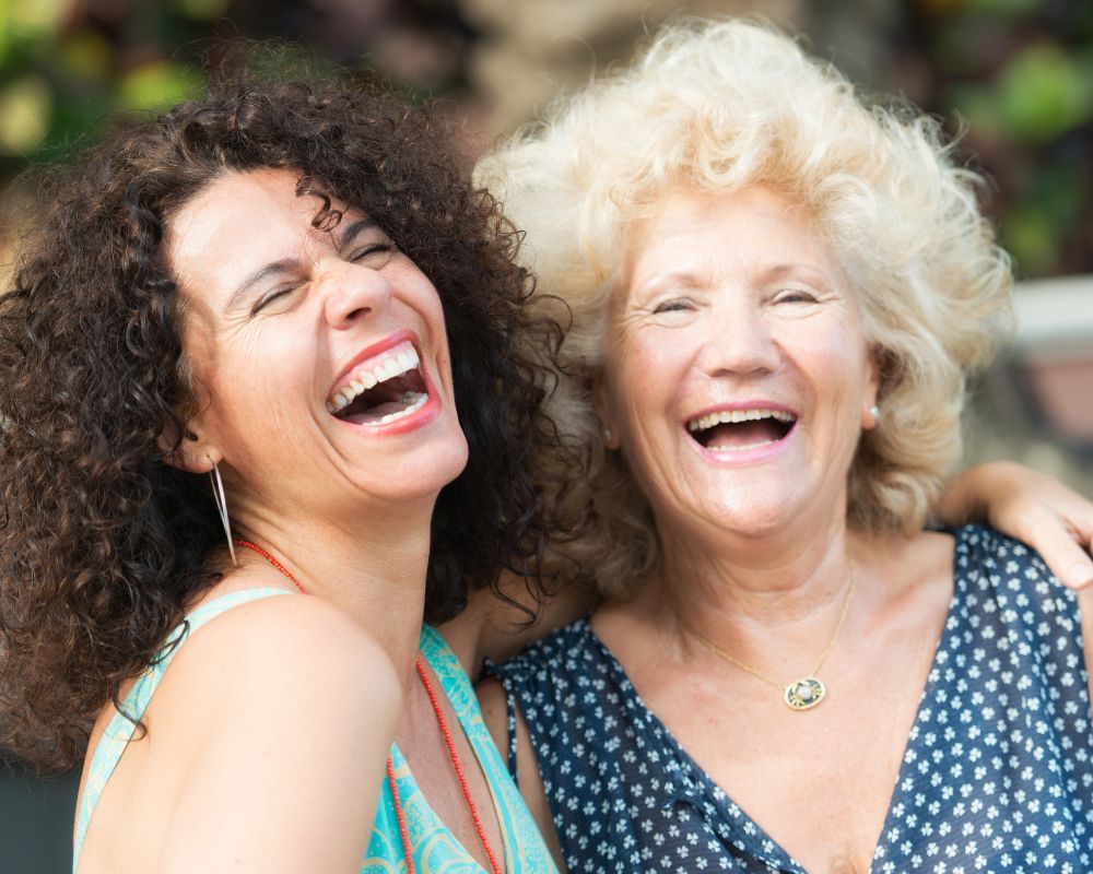 young woman laughing with grandmother